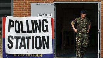 A soldier in the Royal Artillery leaves a polling station after casting his vote (Reuters/Luke MacGregor)