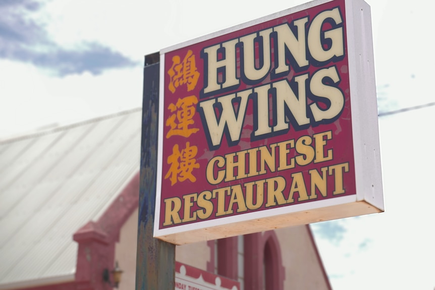 A sign labelled "Hung Wins Chinese Restaurant"