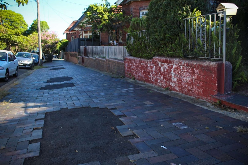 Heritage-listed footpath along Juliett Street in Marrickville showing the repair marks after NBN installation.