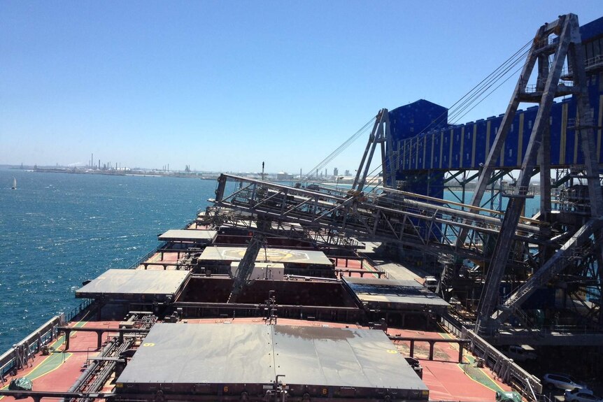 A canola ship loads at Kwinana bulk terminal in Western Australia, bound for overseas