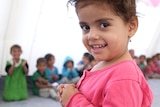 A little girl at a party for kids at Debaga refugee camp.