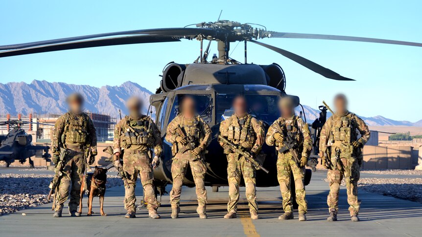 Soldiers from the 3 Squadron SAS stand in front of Black Hawk helicopter in 2012.