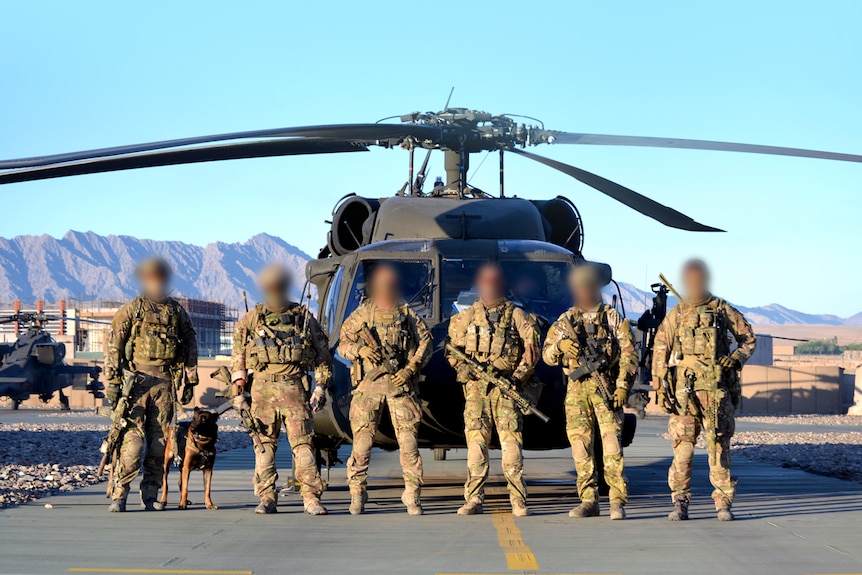 Soldiers from the 3 Squadron SAS stand in front of Black Hawk helicopter in 2012.