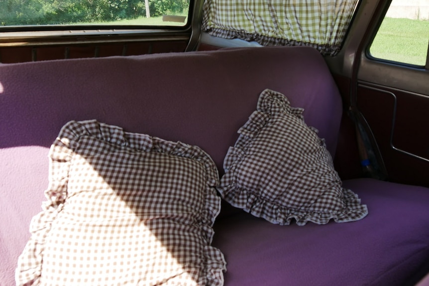 Vintage holden car interior with cushions
