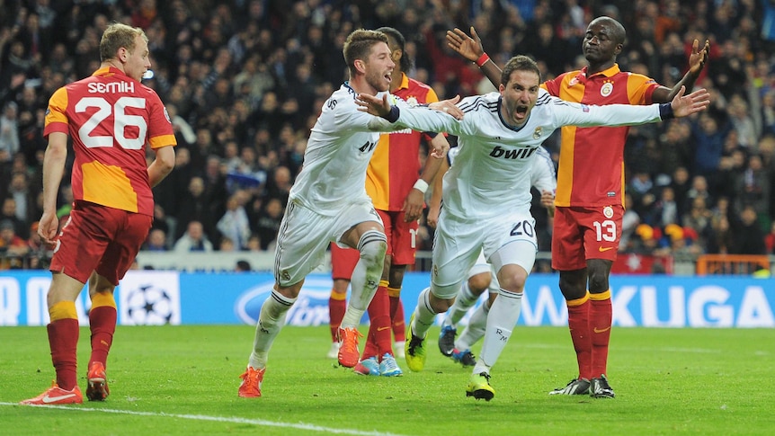 Three and easy ... Gonzalo Higuain celebrates Real Madrid's third goal.