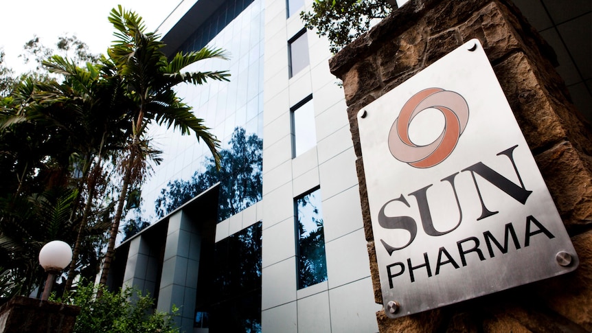 A sign reading Sun Pharma outside a tall building