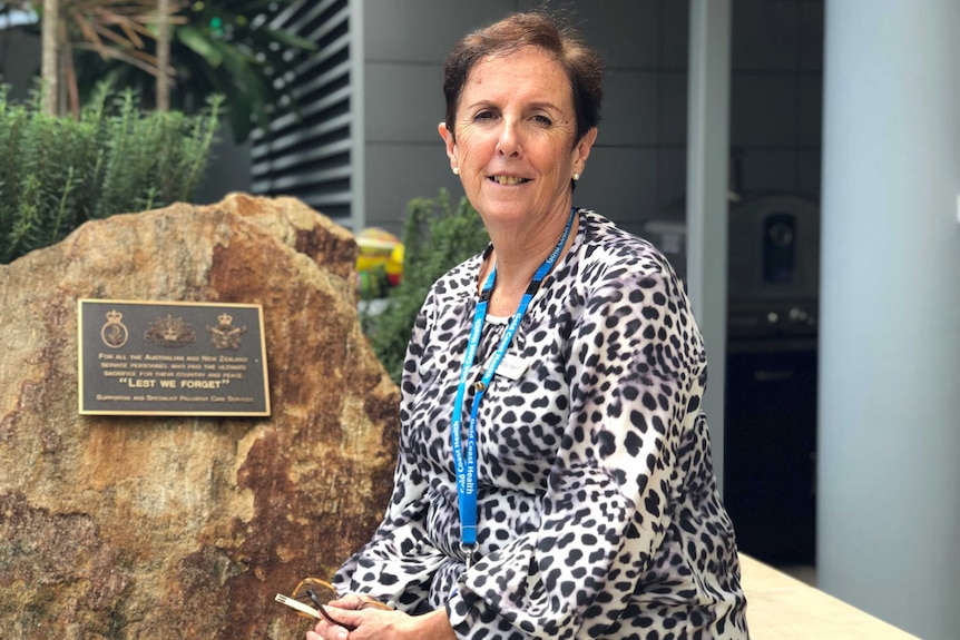 Robina Hospital Nursing Unit manager Maureen Tapfield smiles as she sits outside the hospital.