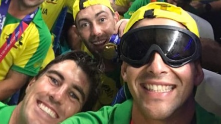 Marcus Stoinis takes a selfie wearing goggles with the Australian team in the background