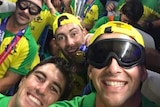 Marcus Stoinis takes a selfie wearing goggles with the Australian team in the background