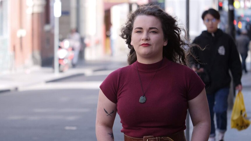 Sophie Worsnop-Hair walks down Little Bourke Street in the Melbourne CBD