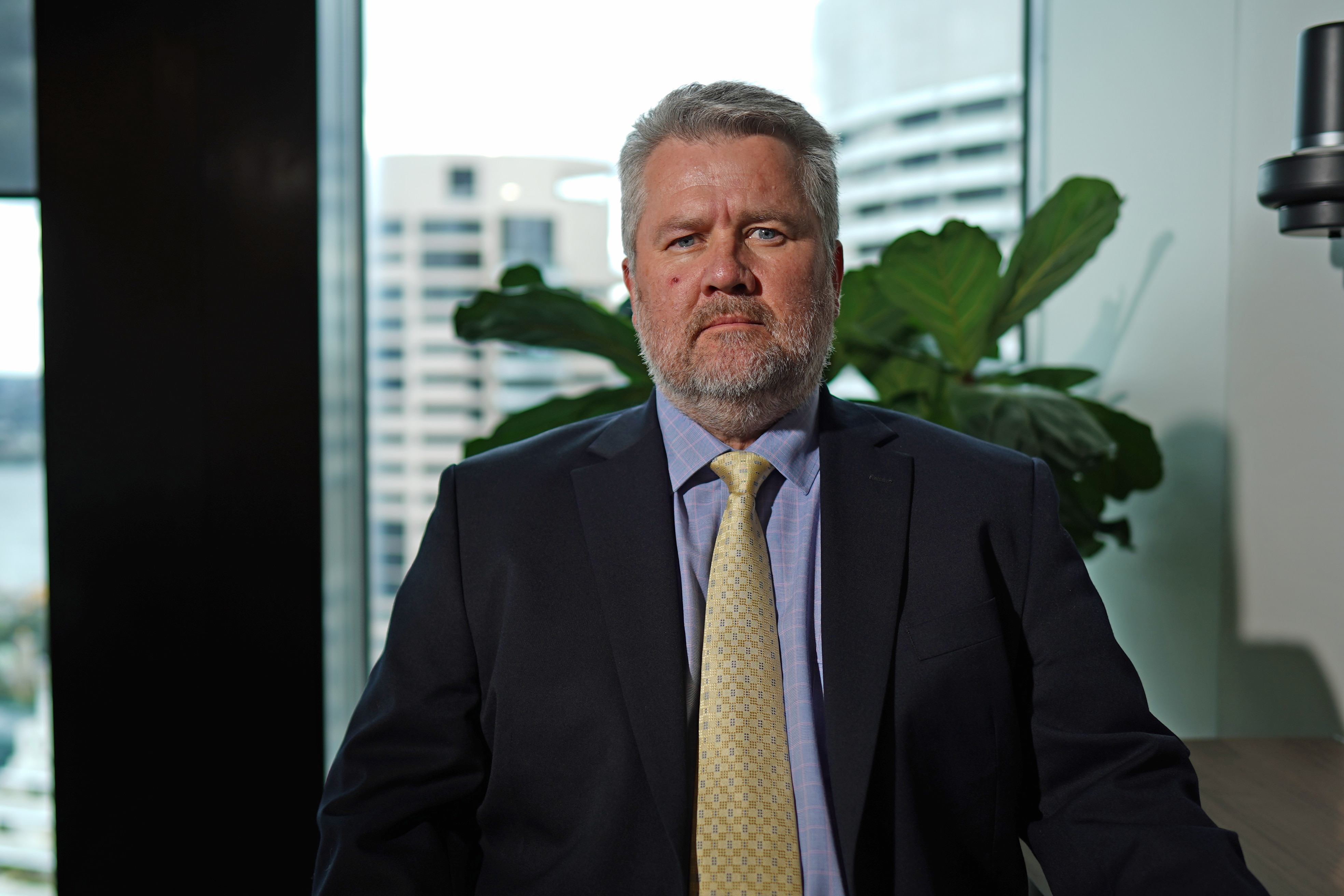 A man wearing a suit and tie.