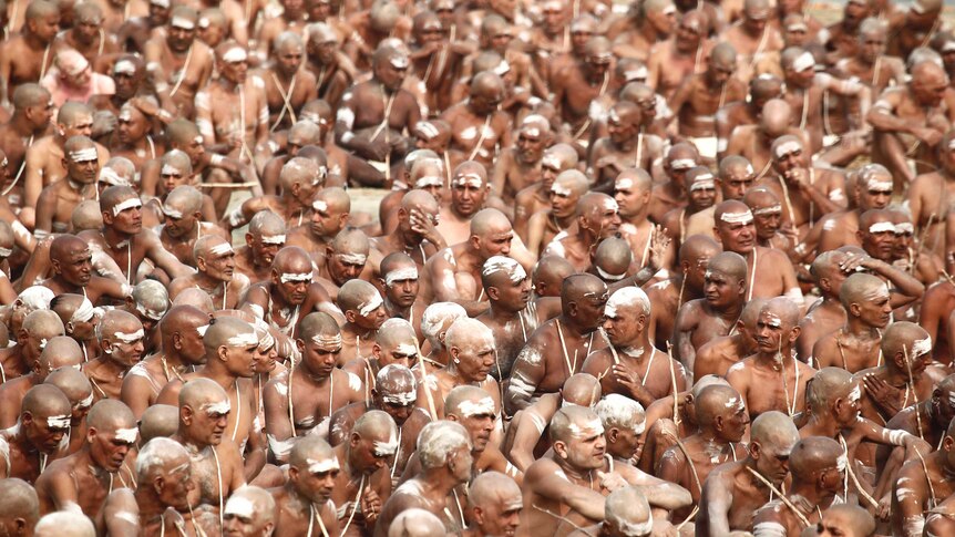 Newly initiated Hindu holy men of the Juna Akhara attend the Dikasha ritual on the banks of the River Ganges.