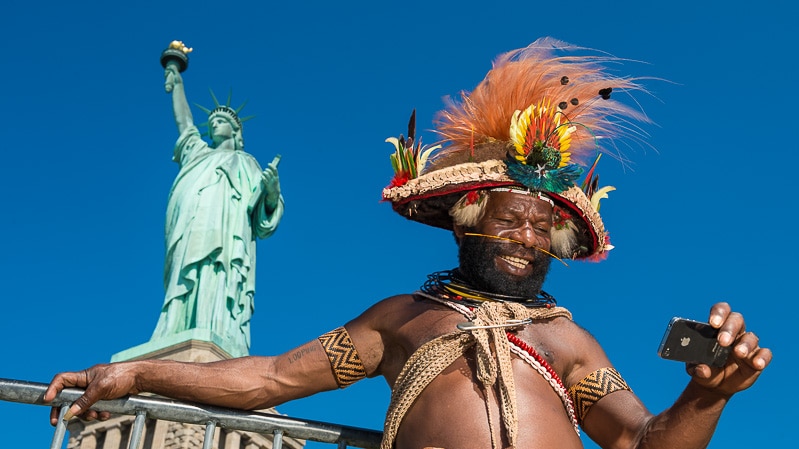 The Huli chief taking a selfie at the Statue of Liberty in New York City.