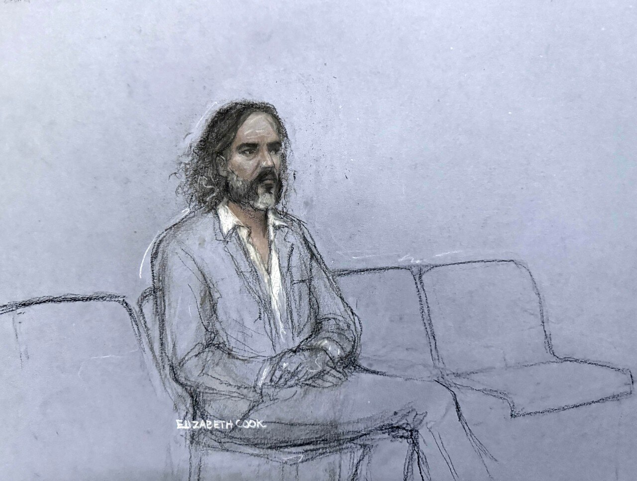 A sketch of a man sitting and looking on.