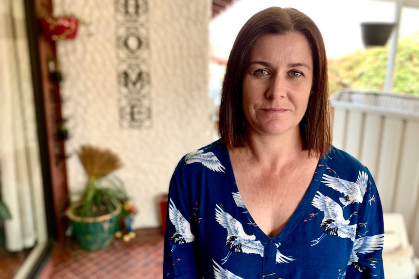 Gretta Dunn stands outside her home in Hammondville, south-west Sydney