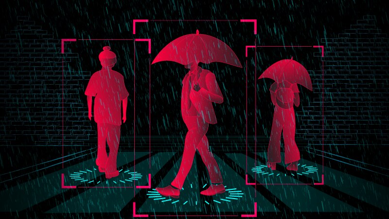 An illustration shows a pedestrian crossing with three people walking across it. Two are holding umbrellas.