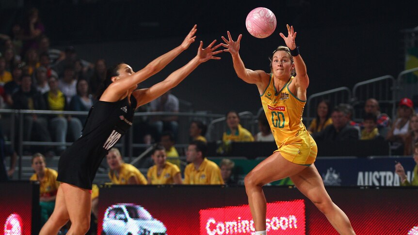 Tight encounter ... Australian goal defence Julie Corletto stretches for a pass in Melbourne.