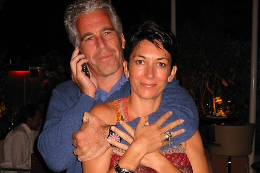 Jeffrey Epstein wraps his arms around Ghislaine Maxwell while holding a phone to his ear