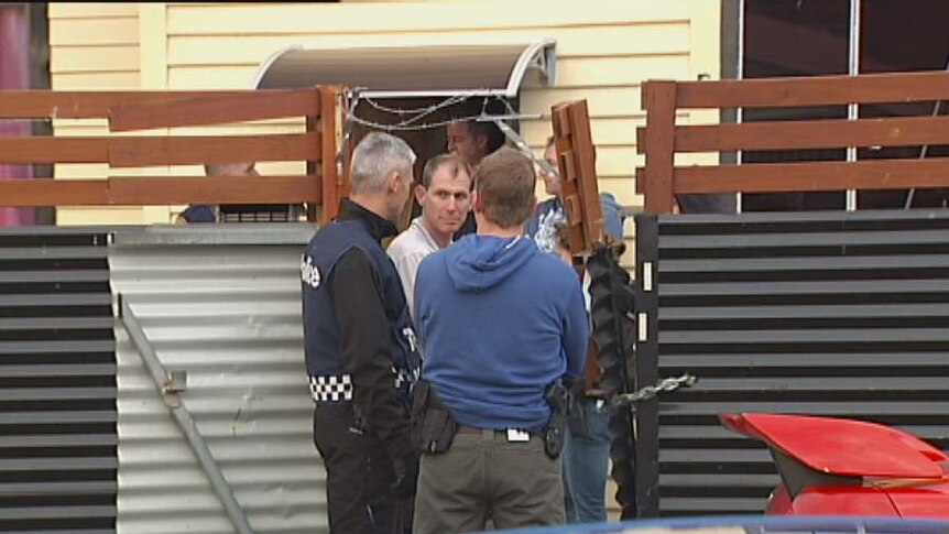 Police outside a house in New Town, Hobart, which was targetted in a drug raid.
