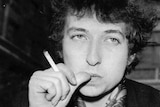 Black and white photo of bob dylan smoking a cigarette in london.