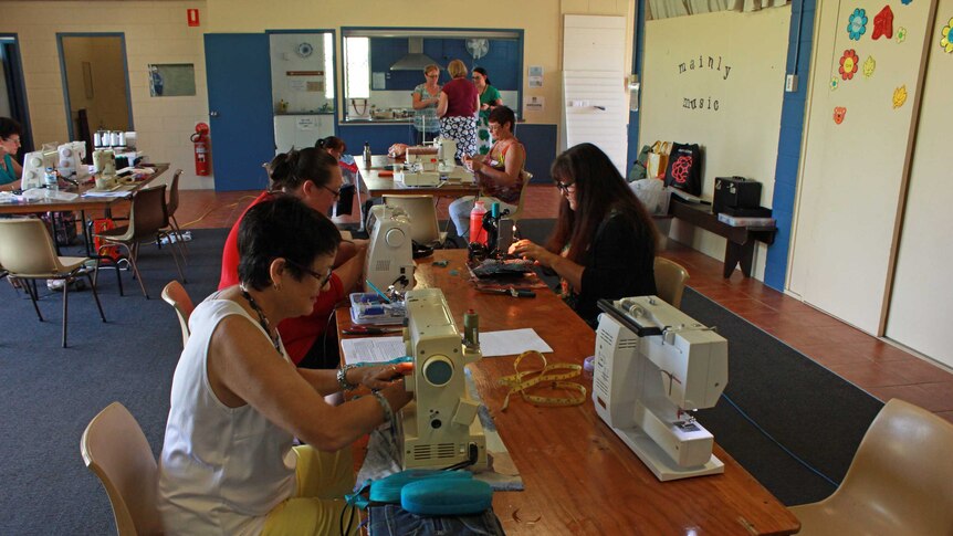 wide shot of women sewing