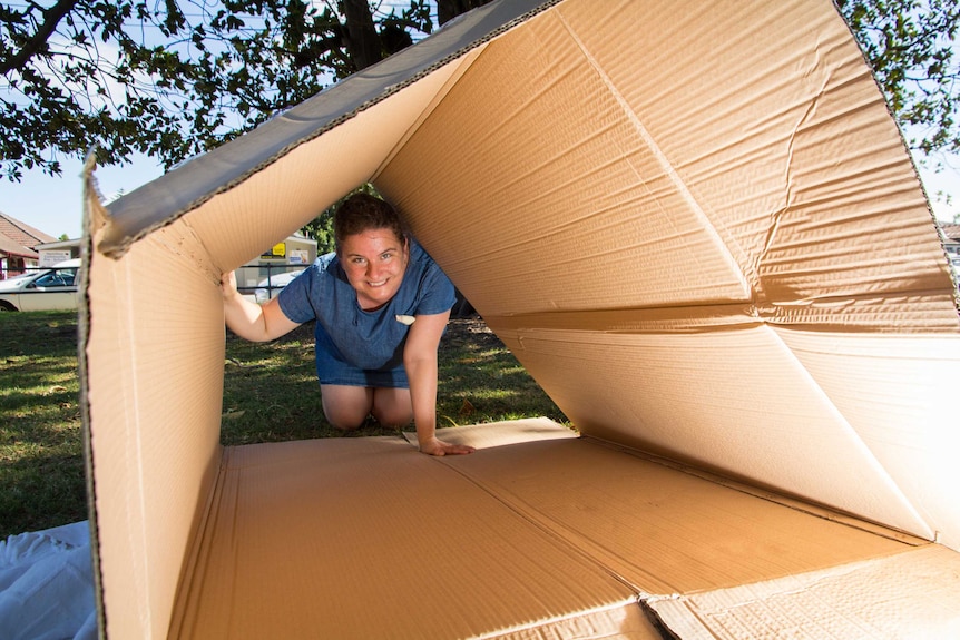 Katie Cadman looks through a box.