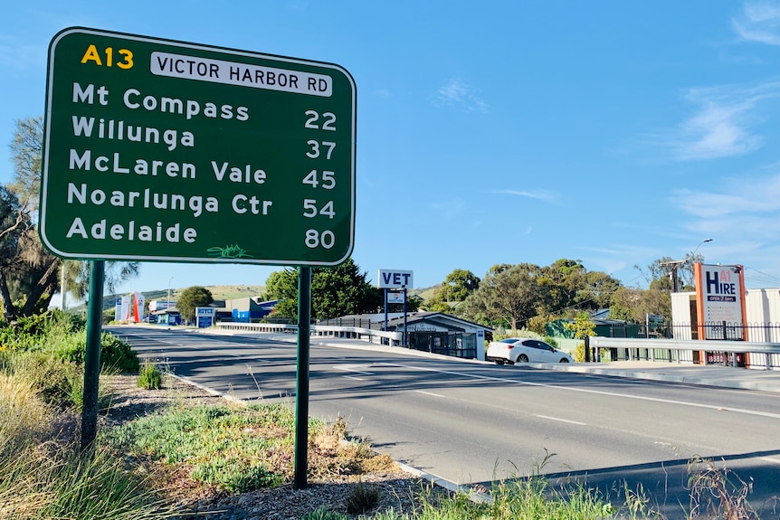 A road sign showing the distance from the South Coast to Adelaide