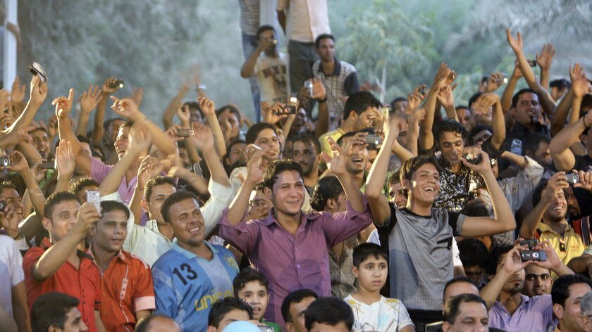 Iraqis cheer at a concert in central Baghdad during festivities celebrating the US withdrawal.