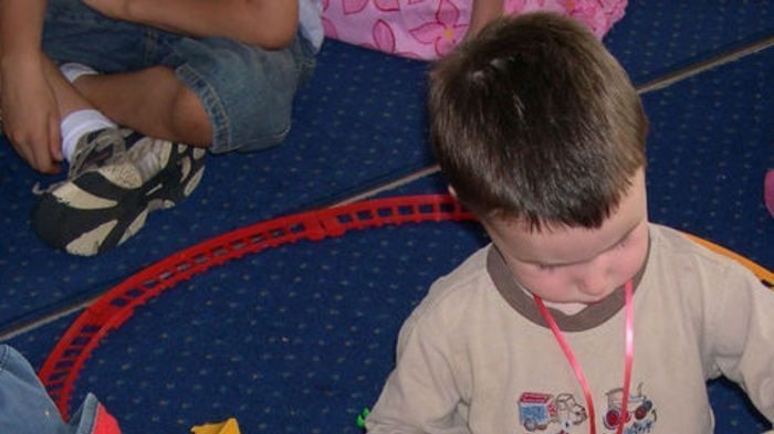 Children playing with train set.