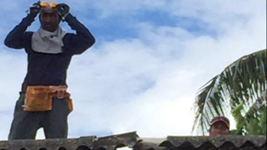 Removing chipped and broken asbestos roofing in Nauru