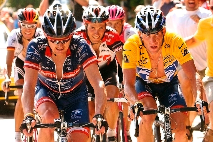 Lance Armstrong rides alongside Floyd Landis during the Tour de France