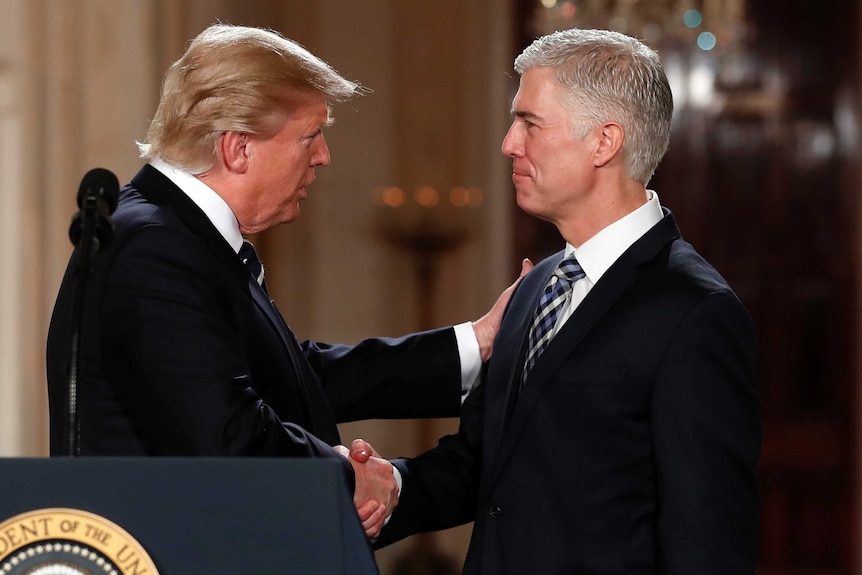 Donald Trump shakes hands with Judge Neil Gorsuch, his choice for Supreme Court Justices.