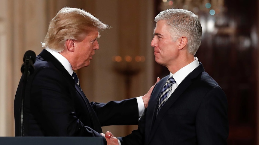 President Donald Trump shakes hands with Supreme Court nominee Neil Gorsuch