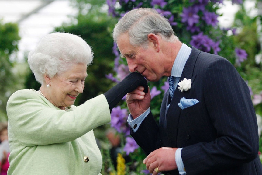 Britain's Prince Charles kisses the hand of his mother, Queen Elizabeth