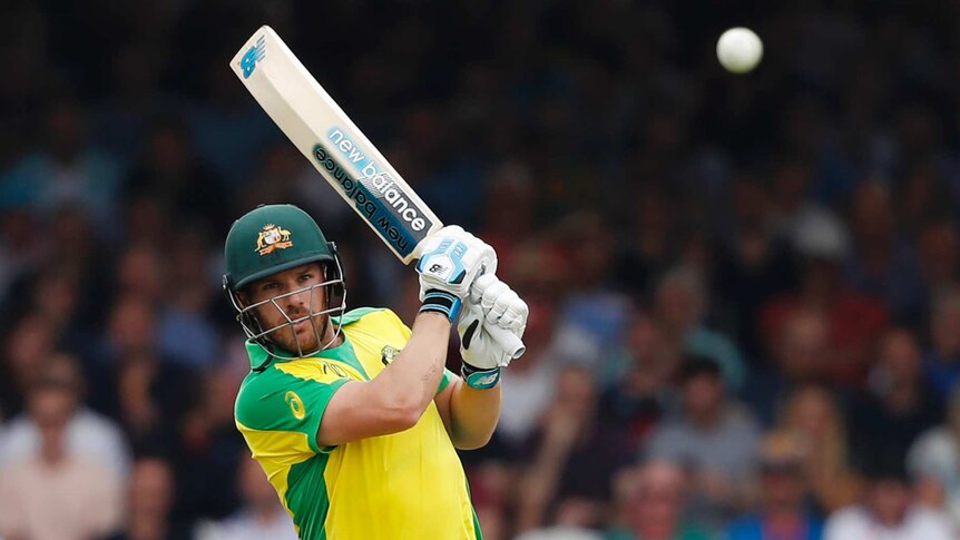 Australia batsman Aaron Finch watches a cricket ball as it fizzes away from his bat during a World Cup match against England.