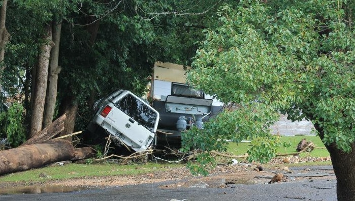 Truck and Campervan in bushes after flood at Stroud