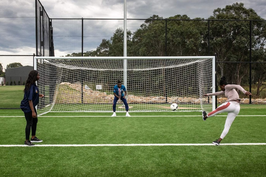 Men and women play football