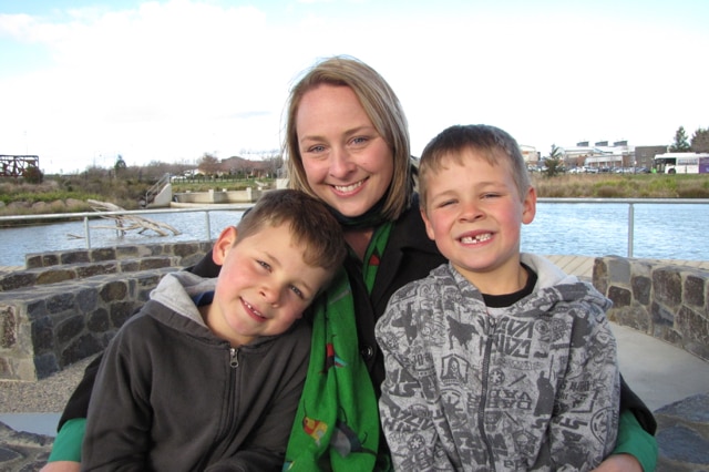 Twins Benji and Mason hugging their mother Belinda Cox.