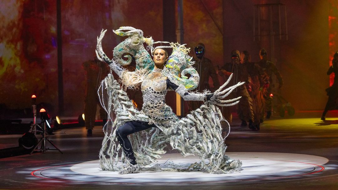 Lady in costume made out of ghost nets