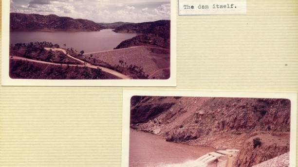 A photo album with three pictures of a dam
