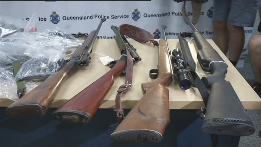 TV still of rifles seized in police bikie raids in far north Qld. Wed June 4, 2014
