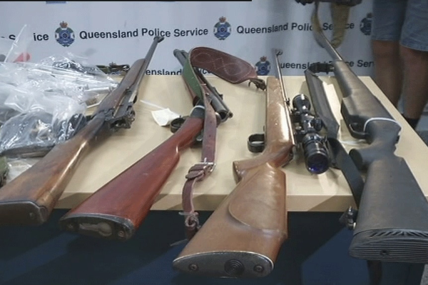 TV still of rifles seized in police bikie raids in far north Qld. Wed June 4, 2014
