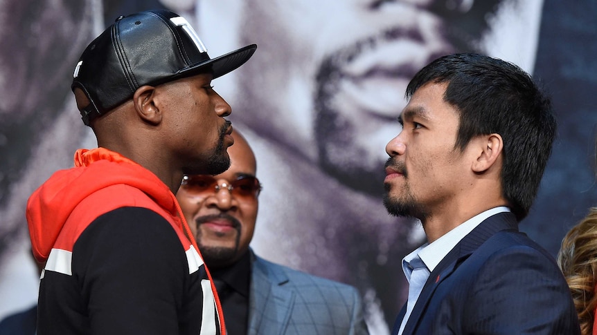 Mega bout ... Floyd Mayweather (L) and Manny Pacquiao face off during their media conference