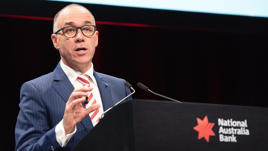 Andrew Thorburn speaking behind a lectern in 2018.