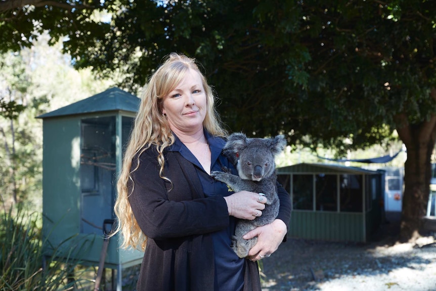 Ms Longman cradles 18-month-old Wila at her home in Jimboomba, south of Brisbane.