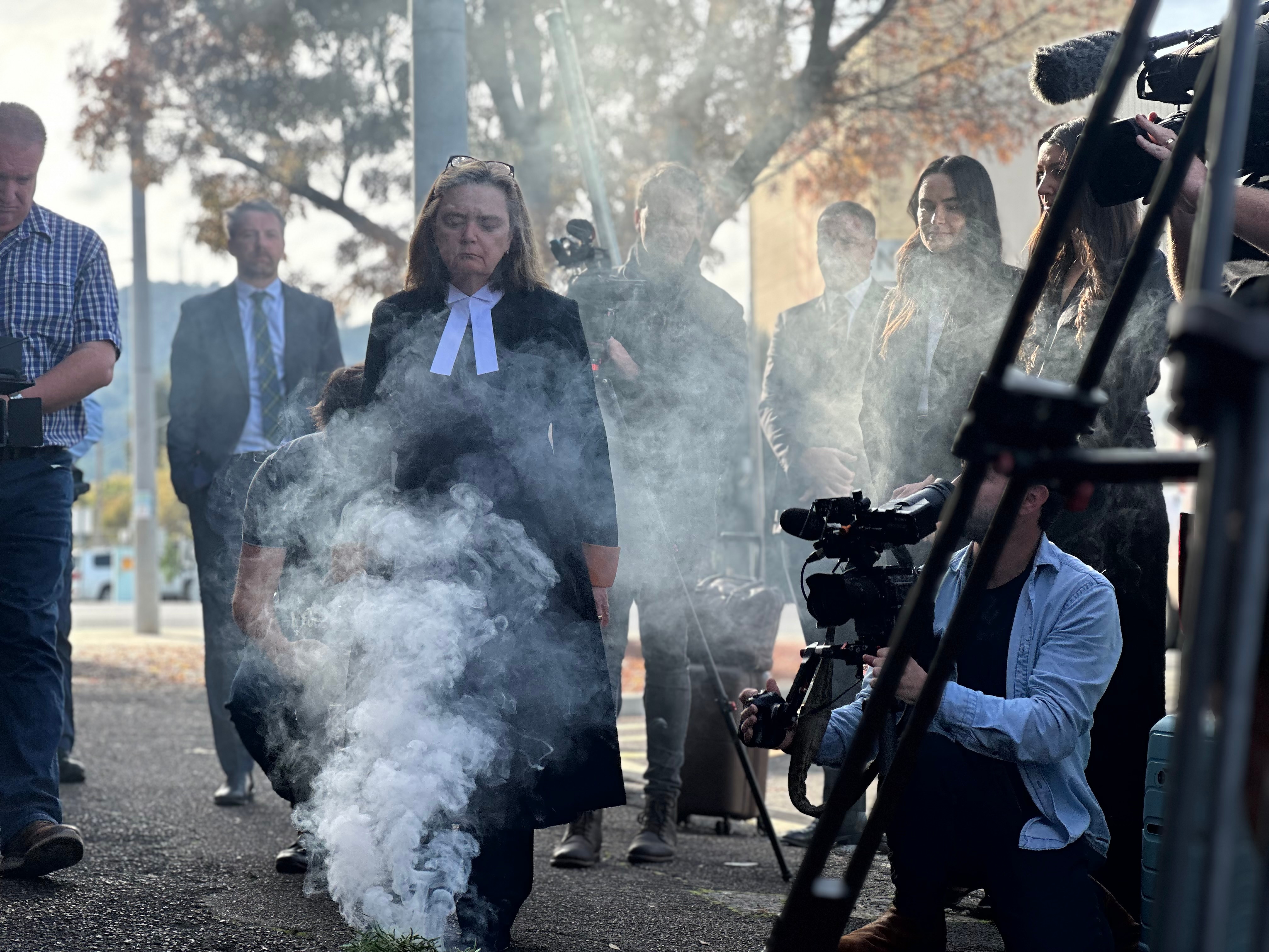 People attend a smoking ceremony