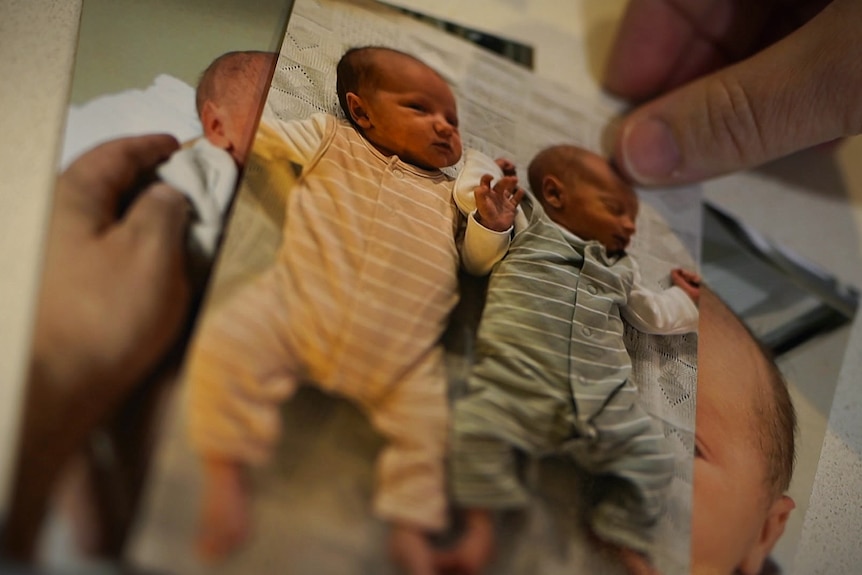 Hard copy of photos of two babies being held by someone.
