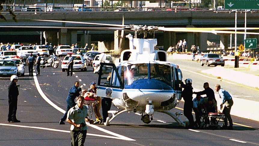 A rescue helicopter uses Washington Blvd outside the Pentagon after the Sept 11 attack