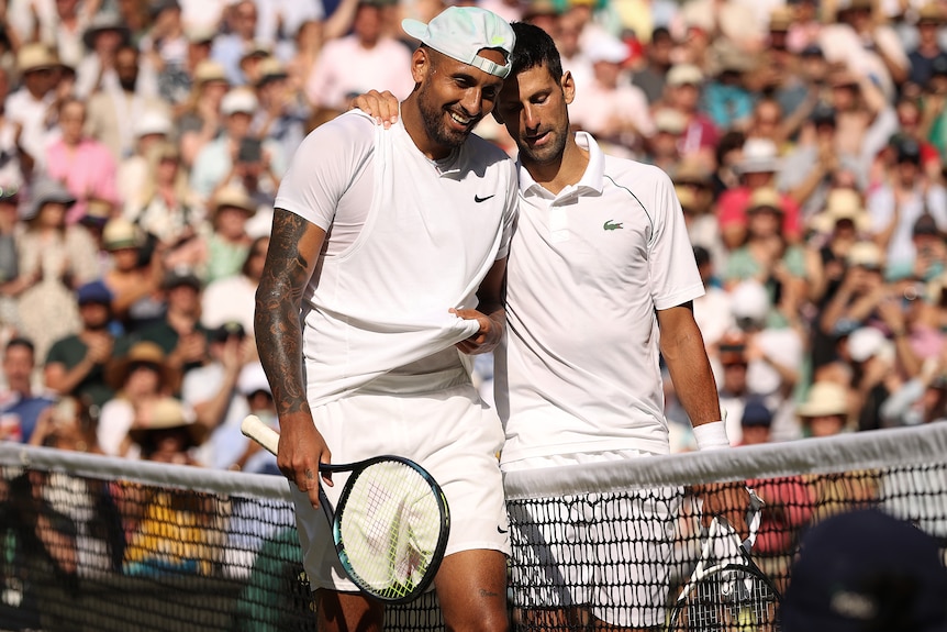 Nick Kyrgios and Novak Djokovic embrace after 2022 men's Wimbledon final.