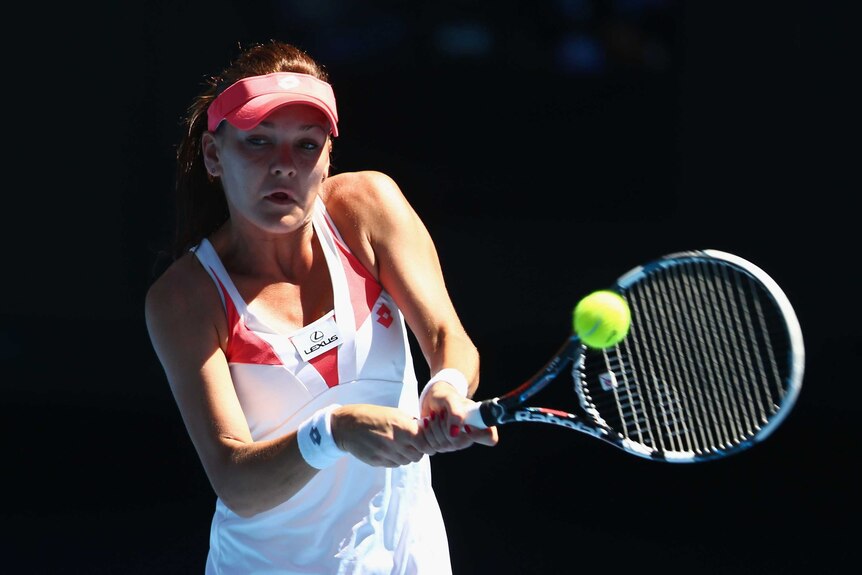 Poland's Agnieszka Radwanska plays a backhand against Irina-Camelia Begu of Romania.